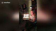 Woman sets her hair on fire with birthday cake