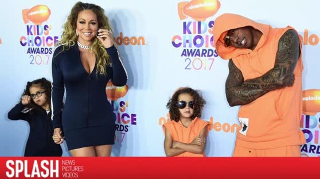 Mariah Carey und Nick Cannon stehen als Familie auf dem roten Teppich