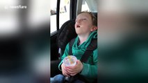 Sleepy toddler won't let go of his ice cream