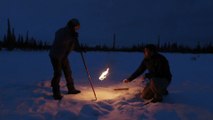 Igniting methane trapped under ice from permafrost