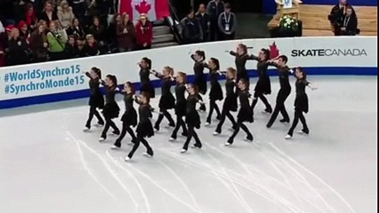 The skaters line up on the ice. Then the music starts and perform breathtaking choreography!