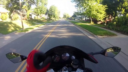 Motorcycle Vlogger Crashes After Attempt to Throw Business Cards