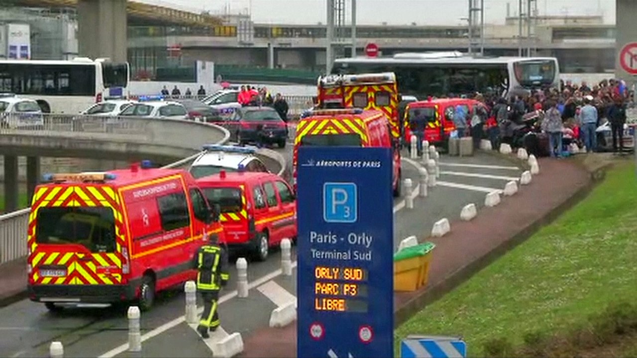 France's Macron salutes soldiers in airport, after shooting