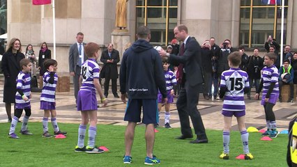 Kate and William play rugby in front of Paris' Eiffel Tower