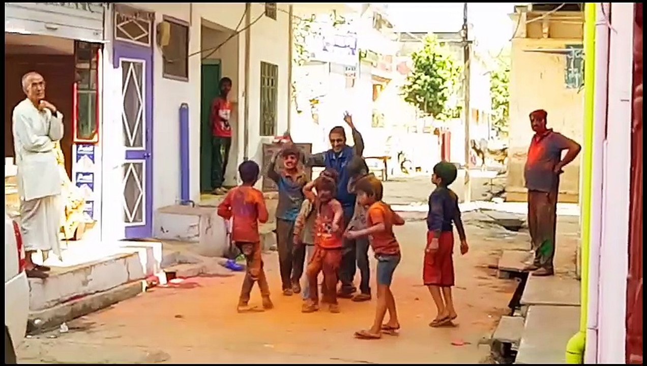 People Dancing & Playing with Colors in The Festival of Colors Holi 2017