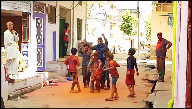 People Dancing & Playing with Colors in The Festival of Colors Holi 2017