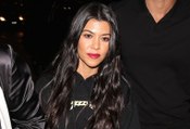 Kourtney Kardashian Flashes Leg In Skin-Tight Lace Pants