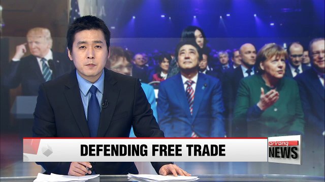 German Chancellor and Japan's PM defend free trade