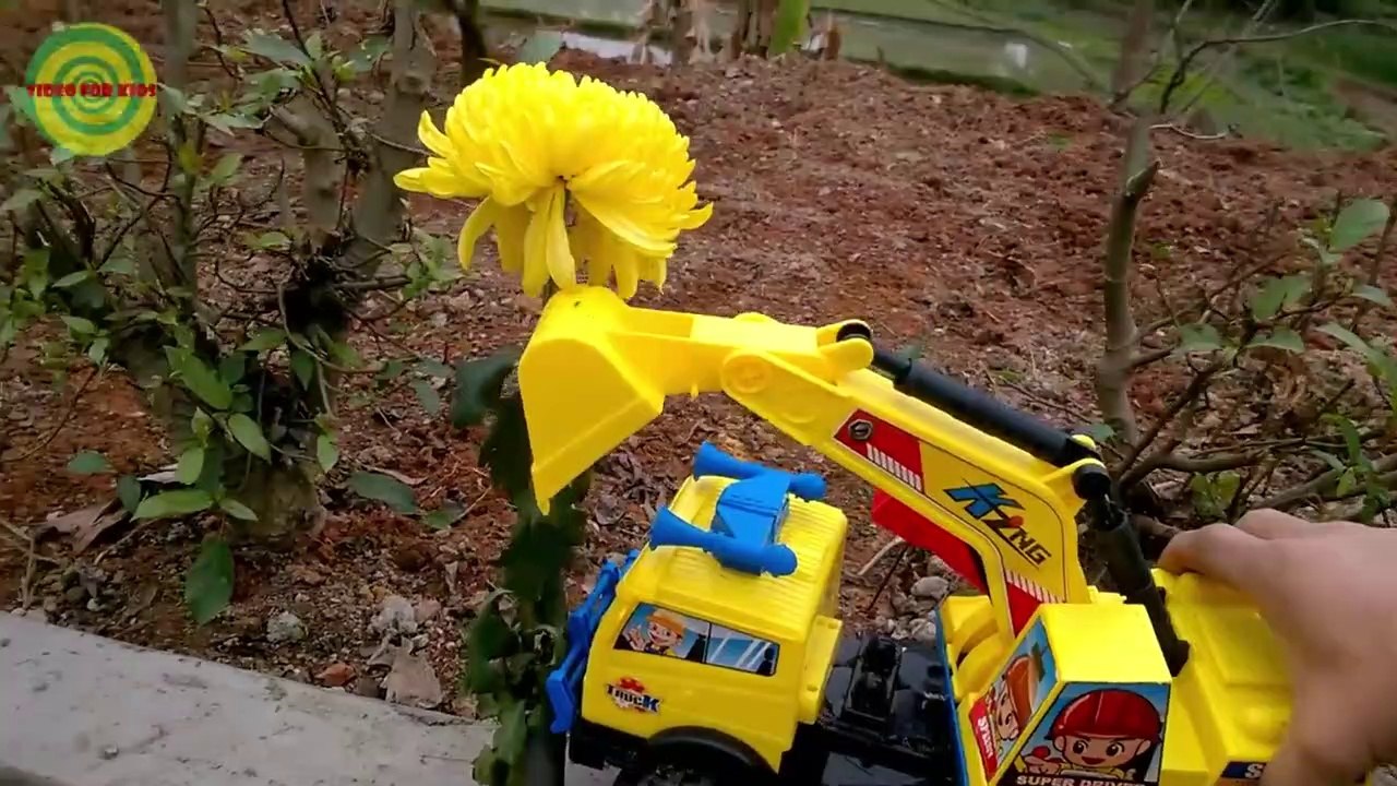 Excavators for kids _ Baby playing excavators destructive the yellow flowers   Toy for children-1j