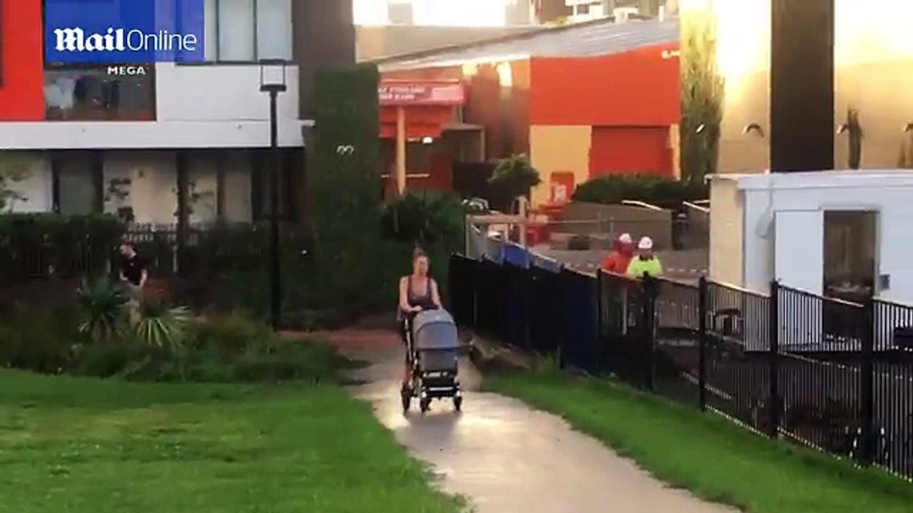 Rachael Finch takes newborn and family dog for a walk in the park