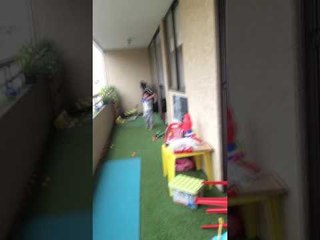 Young Boy Channels Inner 'Happy Gilmore' on Family Balcony