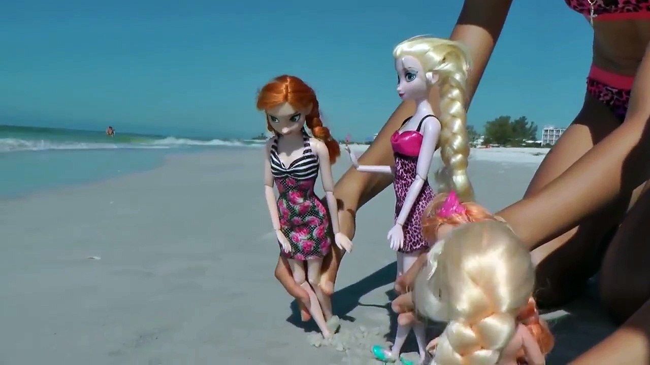 ELSAs SANDCASTLE ! Elsa and Anna toddlers have fun on the BEACH!