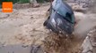 Peru Floodwaters Flip Driver Onto Rocks