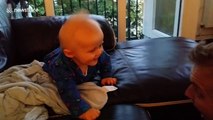 Baby laughs hysterically at peekaboo