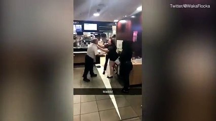 Footage of Man and Woman Wrestling in Middle of McDonald's