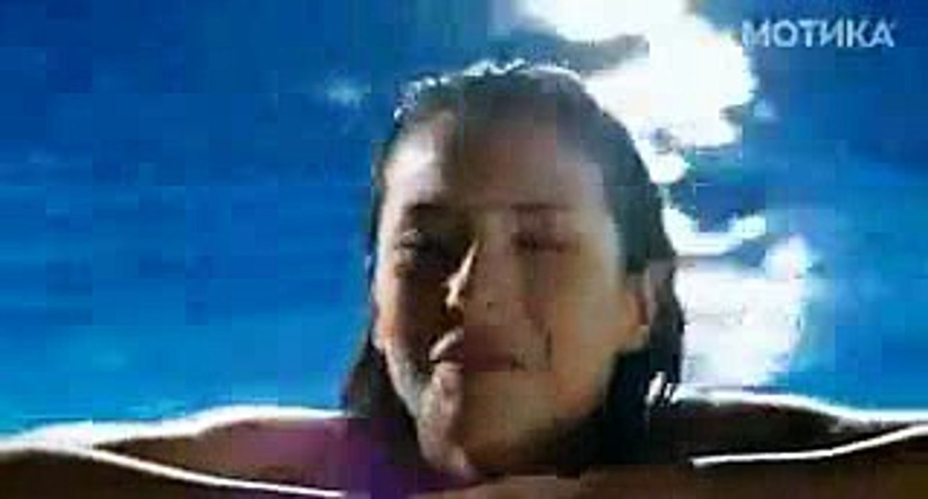 Dolphine touching girl
