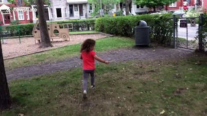 Squirrel surprises young girl by hiding in public bin, then jumping out