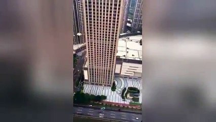 AMAZING Man BASE jumps from the top of a skyscraper in China