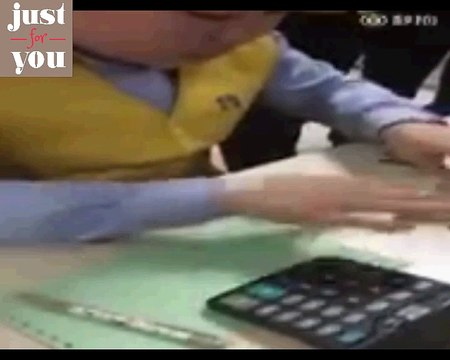 Look at those fingers go! Chinese woman counts money faster than cash-counting machine
