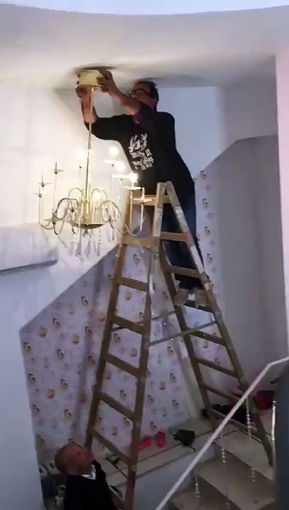 Chandelier, Ladder, Man all crash and fall. Epic Fail.