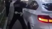 Un policier russe n’arrive pas à casser la vitre d’un 4×4 BMW