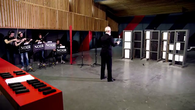 Performing classical music with two handguns.