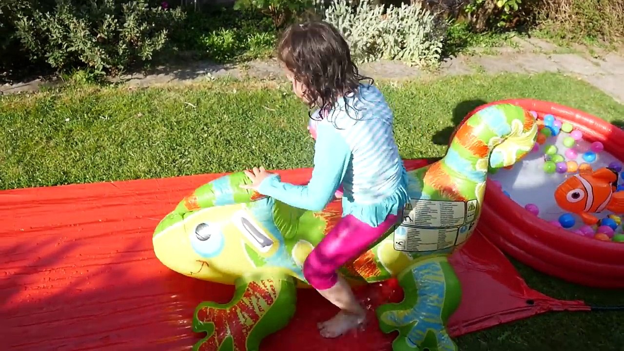 ASSISTANT Inflatable Water Slide Challenge Funny and Huge Toys Bounce House Video