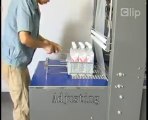 máy co màng lốc chai nước bán tự động , máy cắt dán màng co lốc chai bán tự động