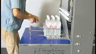 máy cắt dán màng co lốc 6 chai, máy đóng gói màng co lôc chai nước bán tự động