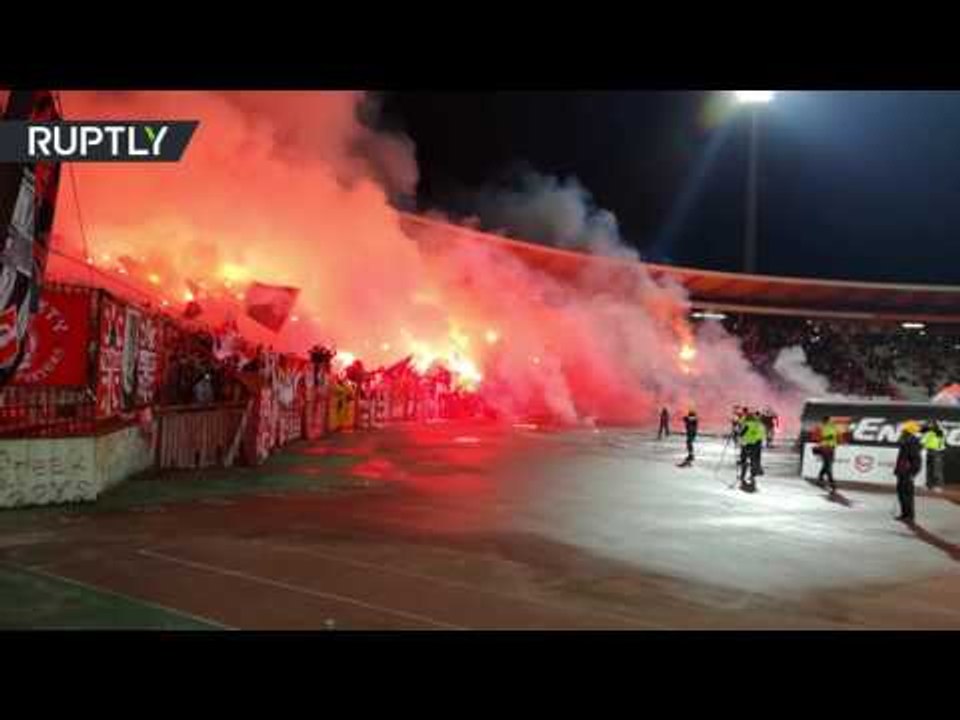Friendly match ends up with flames as fans burn flares at stadium in Serbia