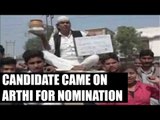 UP Elections 2017: Candidate arrives on arthi to file his nomination : Watch video|Oneindia News