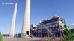 Two giant power station chimneys demolished in controlled explosion