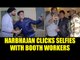 Punjab election 2017: Harbhajan Singh click selfies with booth workers in Jalandhar|Oneindia News