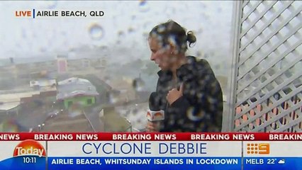 Motorists drive through Cyclone Debbie in Airlie Beach