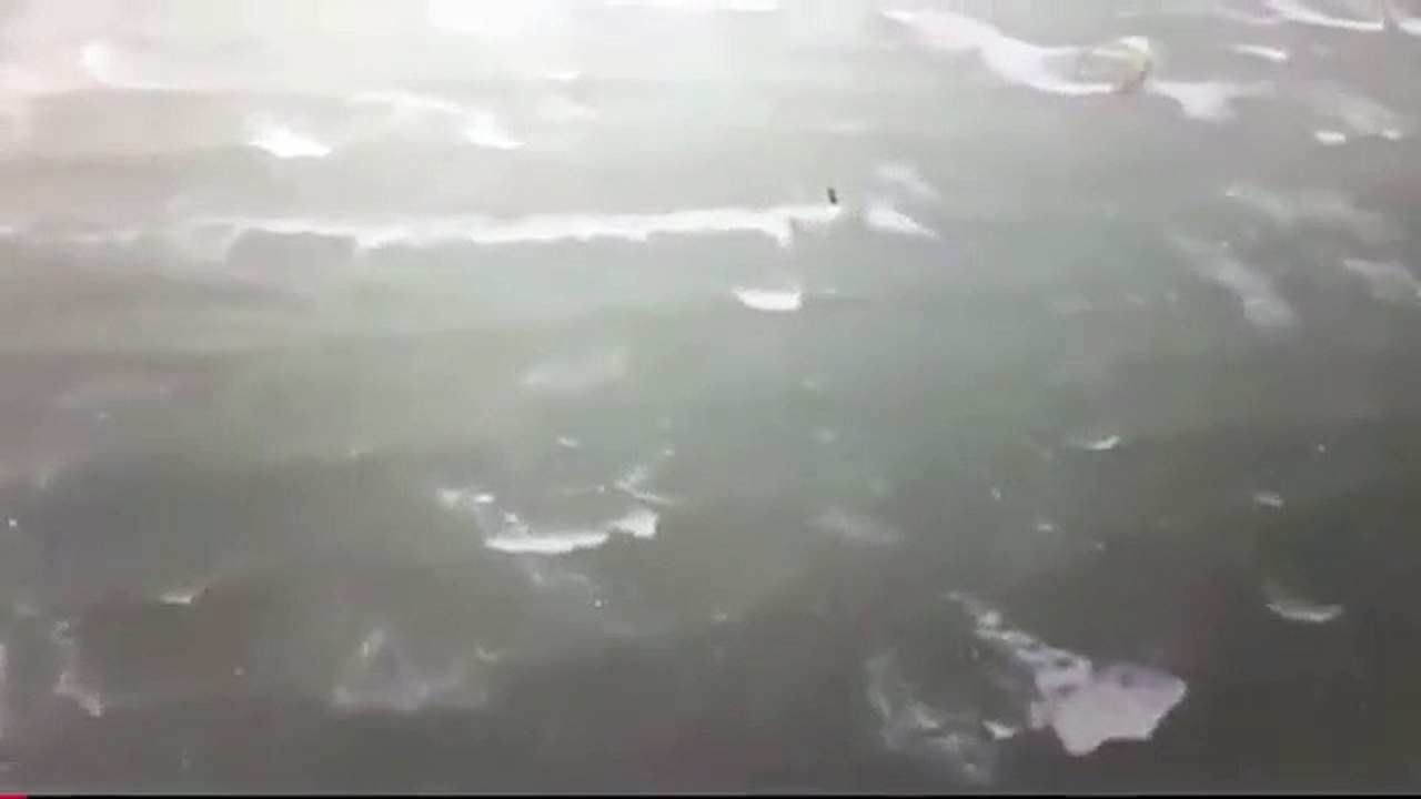 Kite surfers take off in the middle of Cyclone Debbie