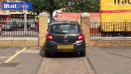 Driver's hilarious attempt to squeeze car through tight gap