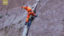 Chinese boy stucak in crevice 100ft above ground is rescued