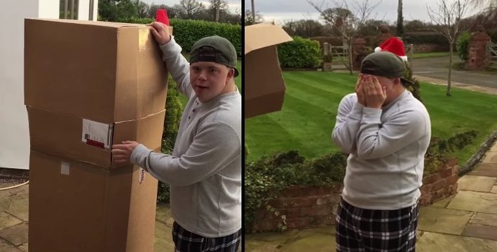 Ce jeune trisomique a reçu un gros colis. Ses parents lui demandent de l’ouvrir et la surprise à l’intérieur est immense