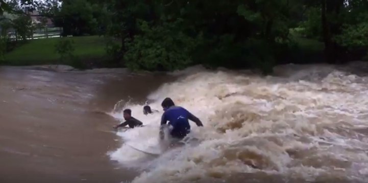 Thrill-Seeking Surfers Dive Into Raging Floodwaters at Murwillumbah Weir