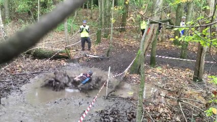 Cyclocross competitor takes break from race - Cannonballs into mud bath!