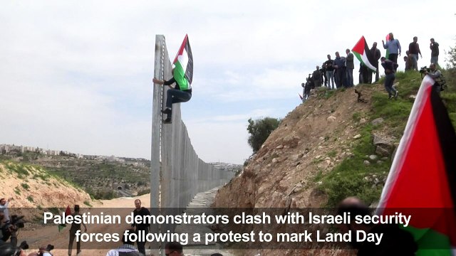 Land day: Palestinian protesters clash with Israeli soldiers