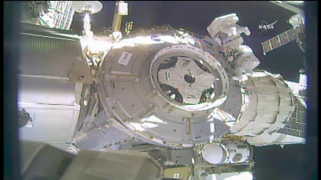 Shield Sails Away from Space Station During Spacewalk