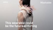 Don't know who's hitting on you? This funky shoulder pad-like wearable will help