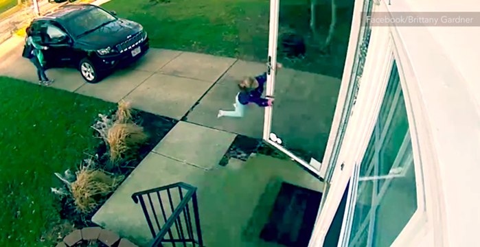 Surveillance captures little girl blown away by strong winds