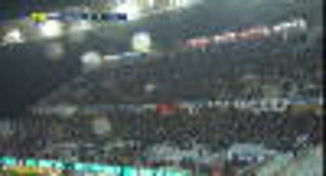 Bastia fans use their phones to light the pitch after a light spot goes off