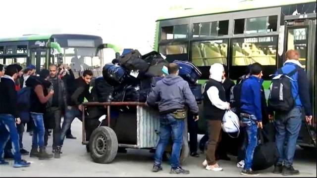 Syrians evacuate Homs' Al Waer district