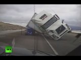 Strong wind sends truck toppling onto patrol car in US