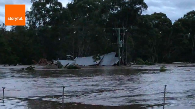 Family Rescued From Floating Barn House