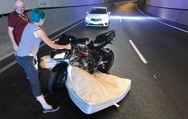motorcyclist in australia crashes with a mattress