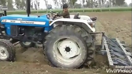 4 year old boy driving tractor